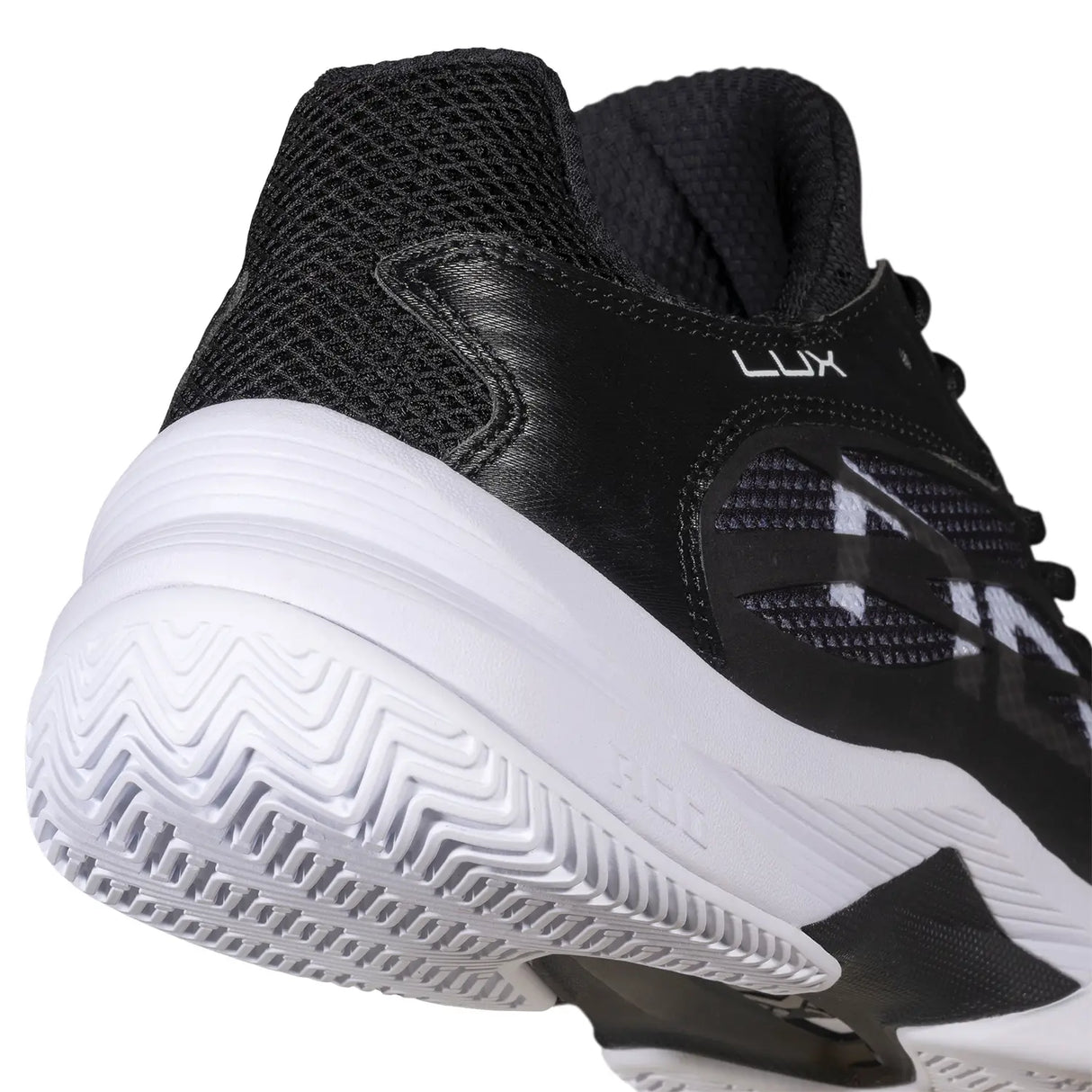 Black and white athletic shoe with NOX branding on a white background