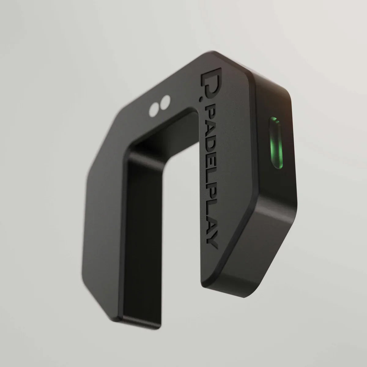 Black hexagonal device with 'PADELPLAY' branding on a gray background