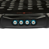 Close-up of a black pad with metallic rivets on a white background