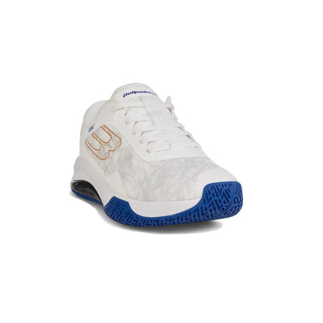 White sneaker with blue sole on a white background