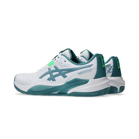 White and green athletic shoe on a white background