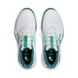White running shoes with green accents on a white background