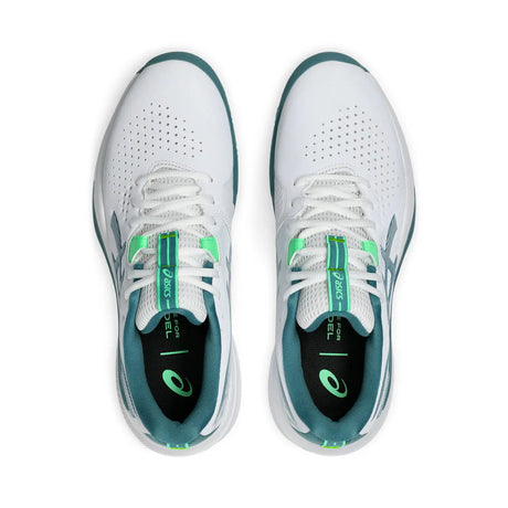 White running shoes with green accents on a white background