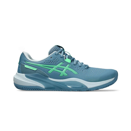 Blue running shoe with green accents on a white background