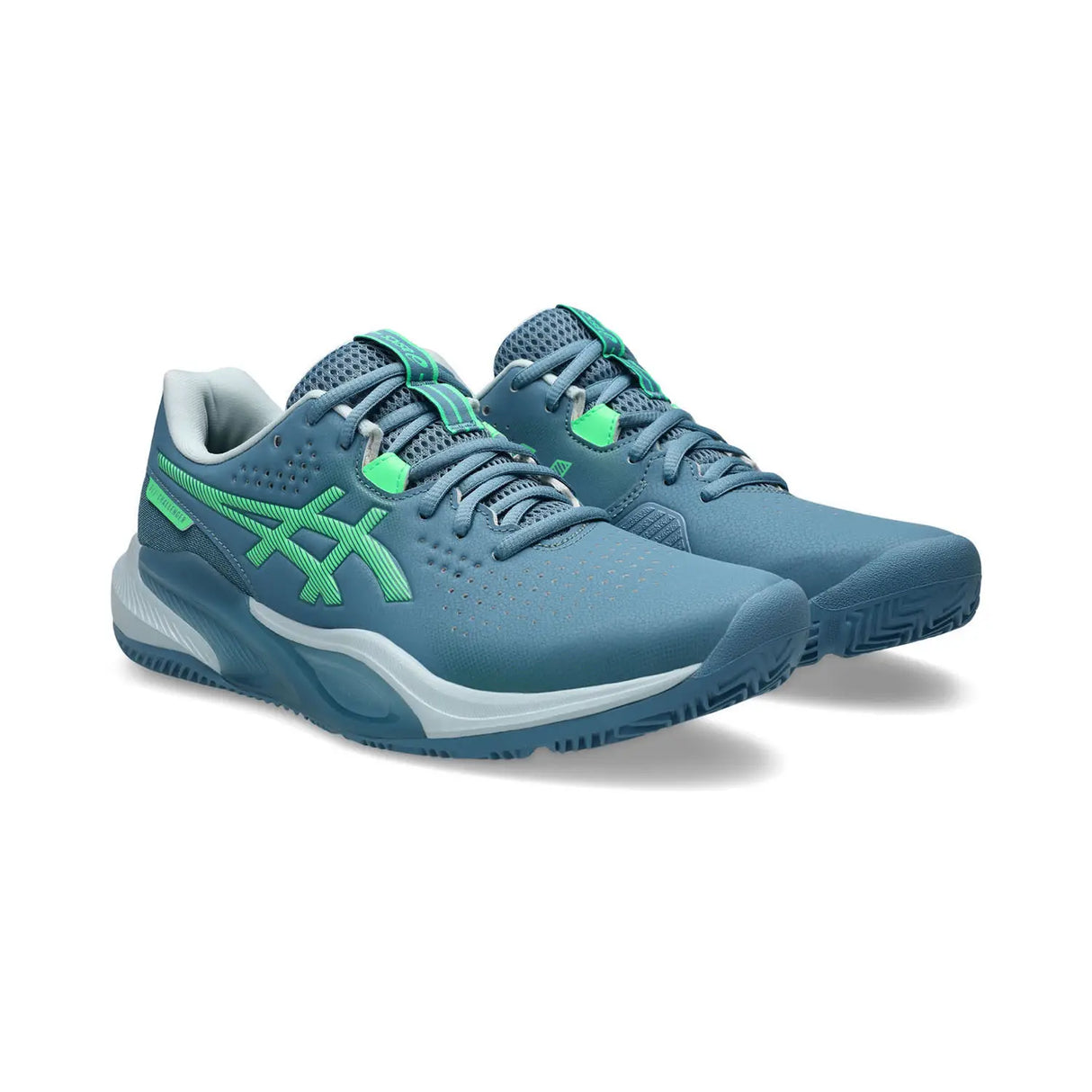 Blue running shoes with green accents on a white background
