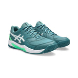 Teal running shoes with white accents on a white background