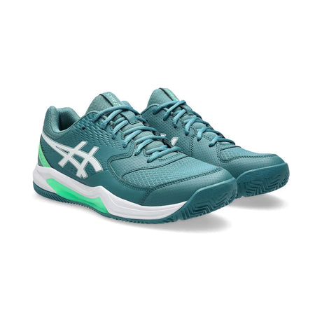 Teal running shoes with white accents on a white background