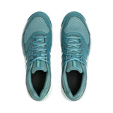 Pair of teal running shoes on a white background