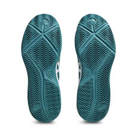 Teal shoe sole with a textured pattern on a white background