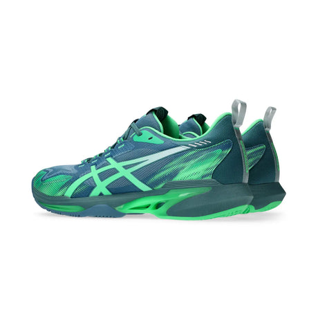 Blue and green athletic shoe on a white background