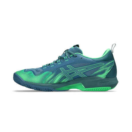 Blue and green athletic shoe on a white background