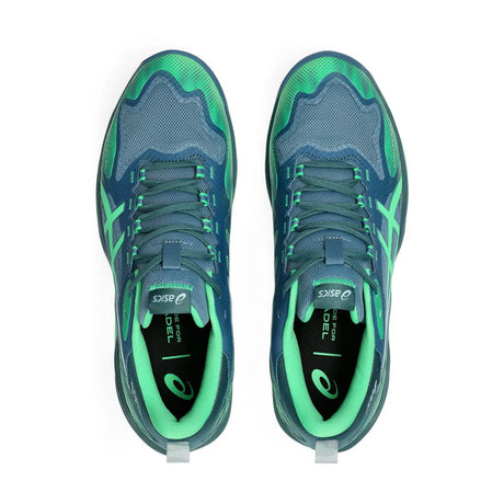 Blue and green running shoes with visible Asics logo on a white background
