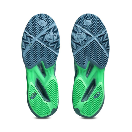 Green and blue athletic shoes with tread pattern on a white background