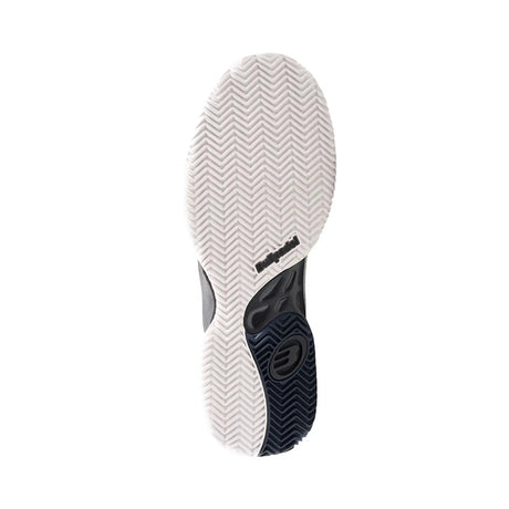 Close-up of a shoe sole with a brand logo on a white background