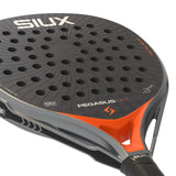Close-up of a black and orange sports racket with 'SIUX' branding on a white background