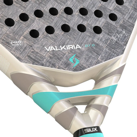 Close-up of a Valkiria Pro padel racket with visible branding on a white background