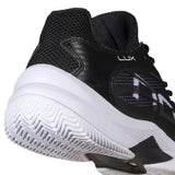 Black and white athletic shoe with NOX branding on a white background