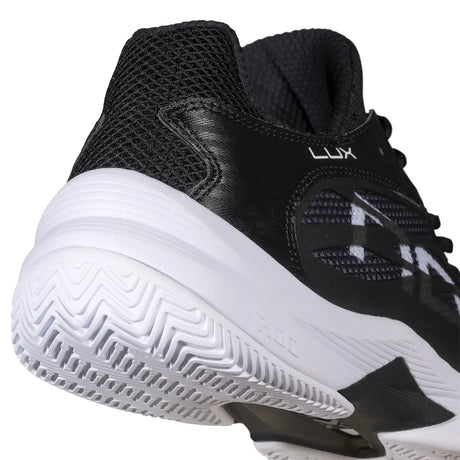 Black and white athletic shoe with NOX branding on a white background