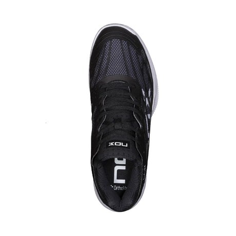 Black athletic shoe with visible branding on a white background
