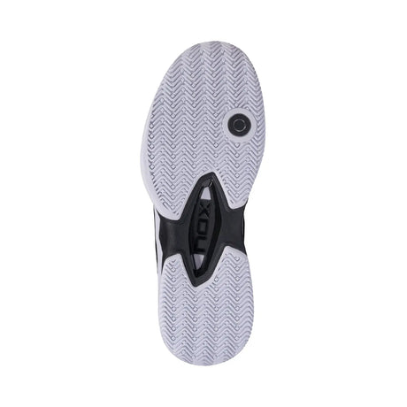 Back view of a sports shoe with a brand logo on a white background