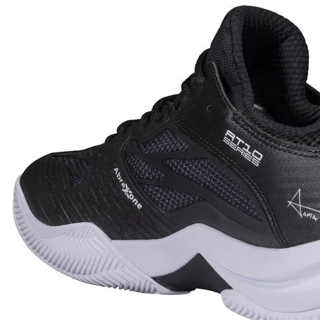 Black athletic shoe with white sole on a white background