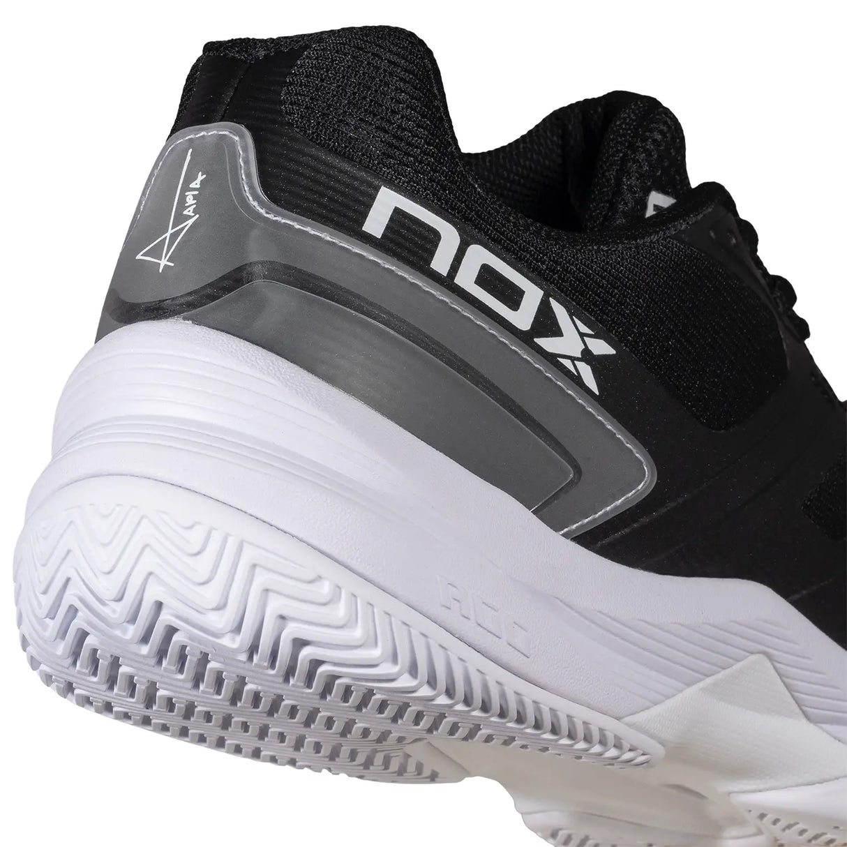 Black and white sports shoe with 'NOX' branding on a white background
