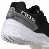 Black and white sports shoe with 'NOX' branding on a white background