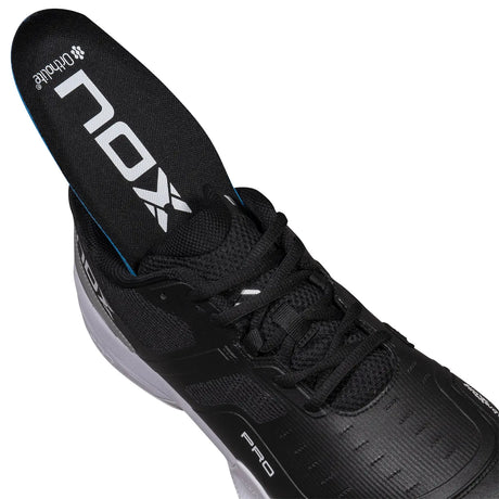 Black athletic shoe with visible brand logo on a white background