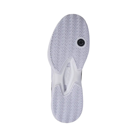 Close-up of a white sneaker sole with tread pattern on a white background