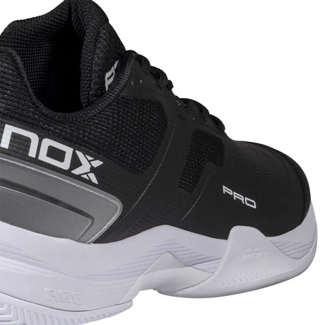 Black and white sports shoe with NOX branding on a white background