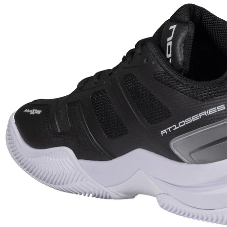 Black athletic shoe with white sole on a white background