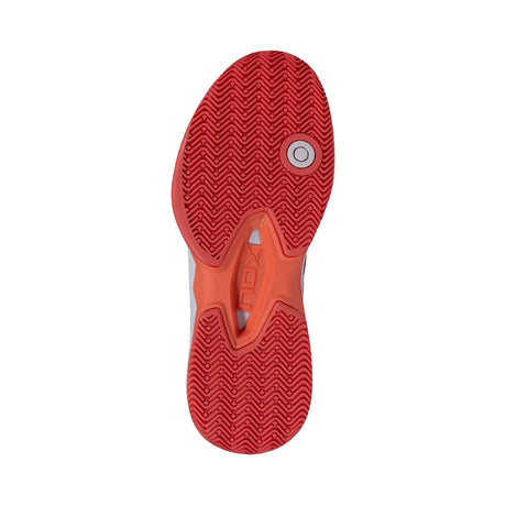 Close-up of a red and orange athletic shoe sole on a white background