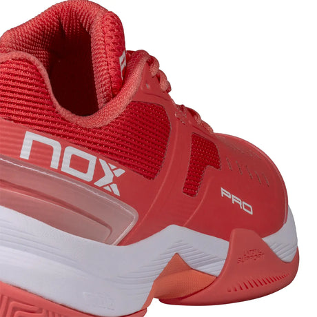Red sports shoe with 'nox' branding on a white background