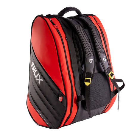 Red and black backpack with 'SIUX' branding on a white background