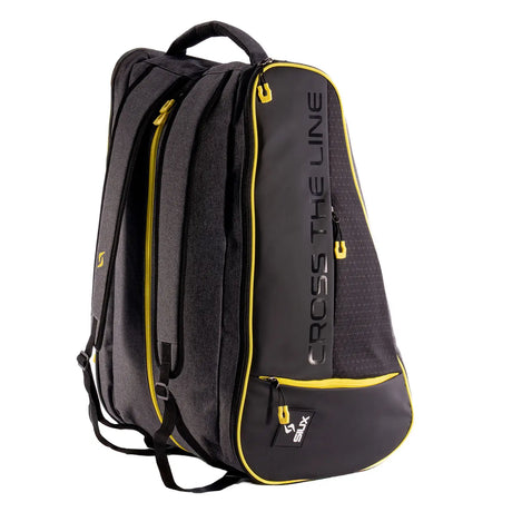 Black backpack with yellow accents and 'Cross the Line' branding on a white background