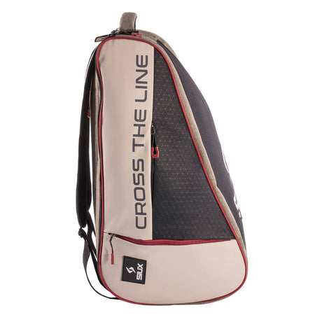 Beige and black sports bag with 'Cross The Line' branding on a white background