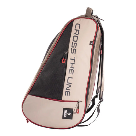 Beige and black sports bag with 'Cross The Line' branding on a white background