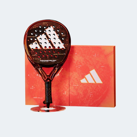 Adidas paddle on a stand with a matching red box in the background
